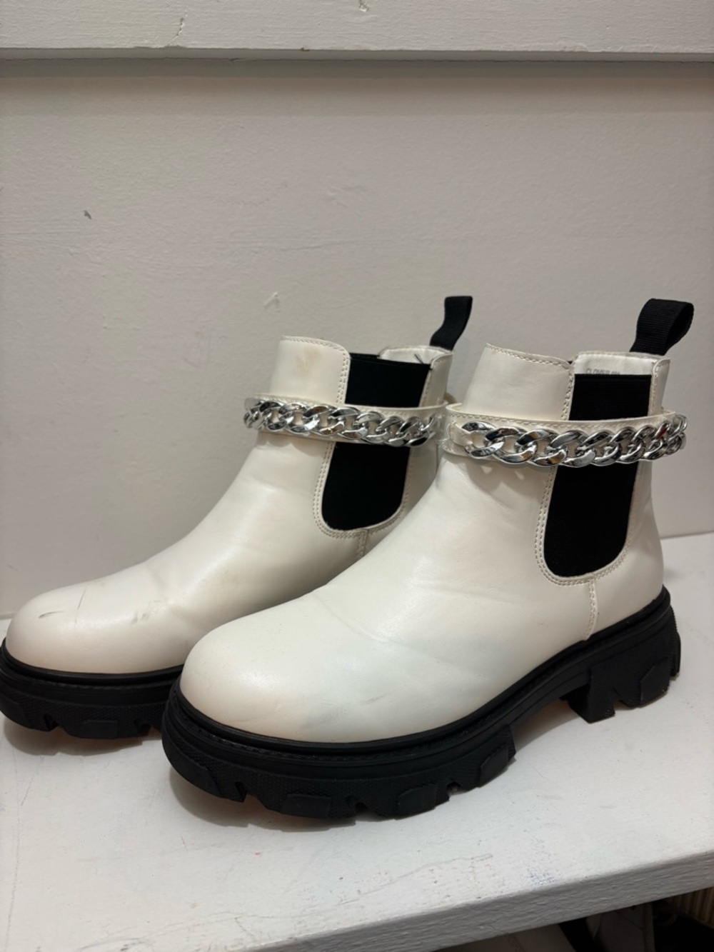 White Chelsea Lug-sole Booties with Silver Chain Accent